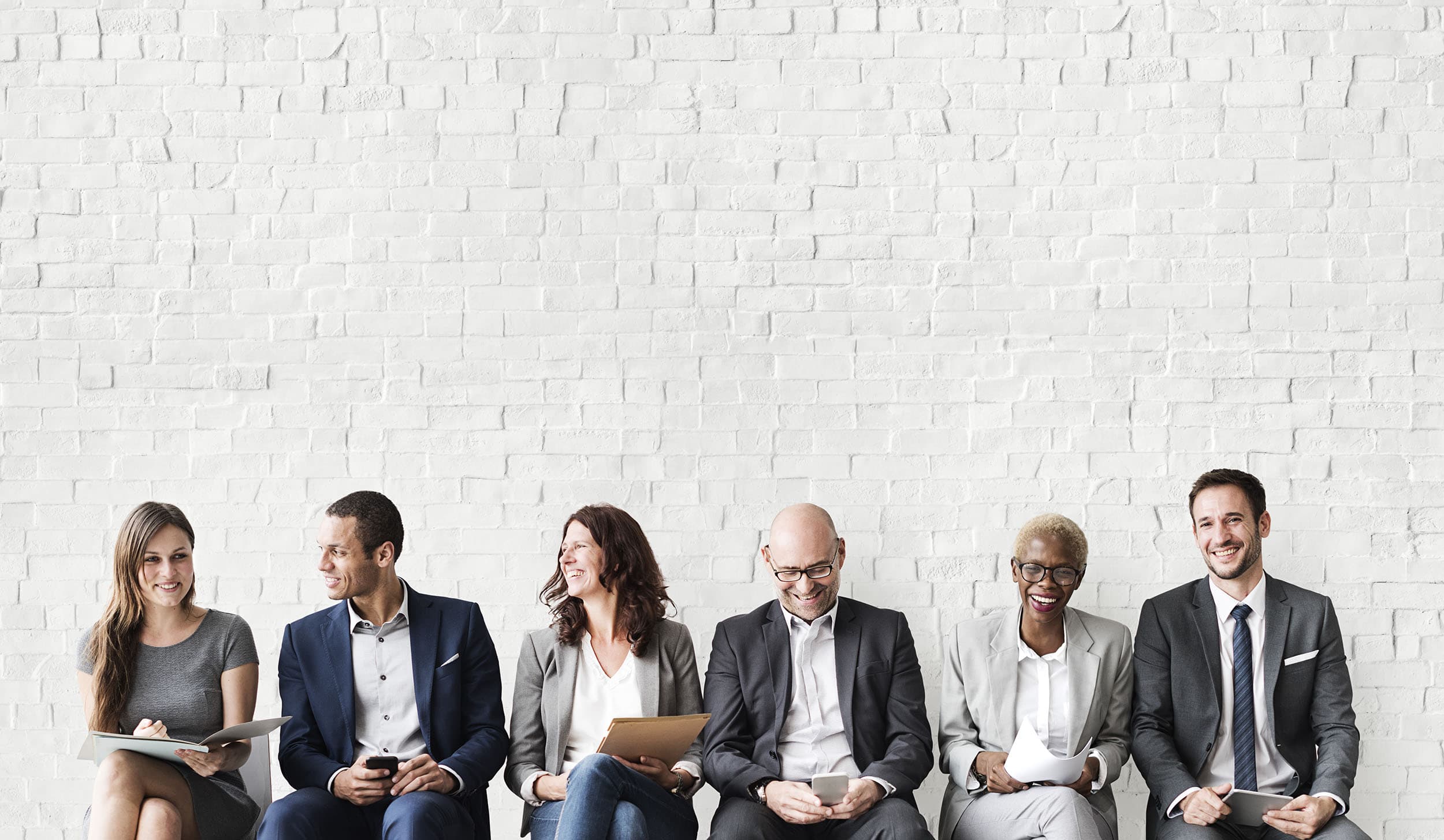 Diverse professionals in a bright open-plan workplace