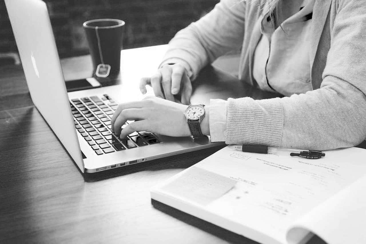 Graduate with a laptop ready to begin a new career opportunity
